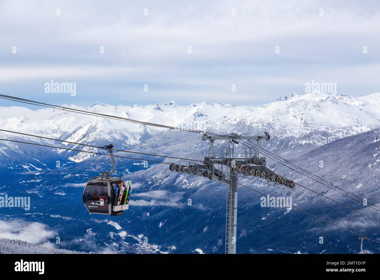 View of the Gondola going up the Mountain with Canadian Mountain Landscape Stock Photo