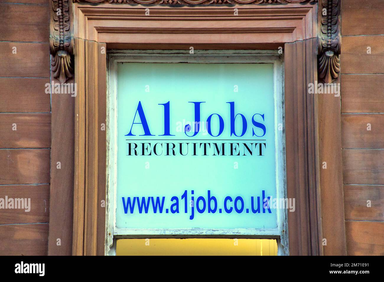 A1 jobs recruitment agency Advert in the window of  First Floor, The Standard Buildings, 94 Hope St, Glasgow G2 6PH Stock Photo