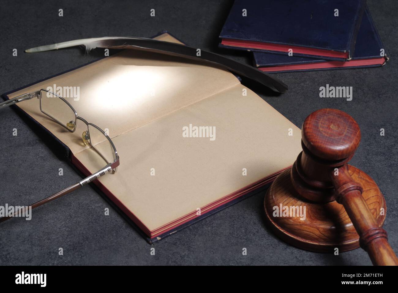 Legal concept of law and justice. Open notebook law book with wooden gavel of judges on courtroom Stock Photo