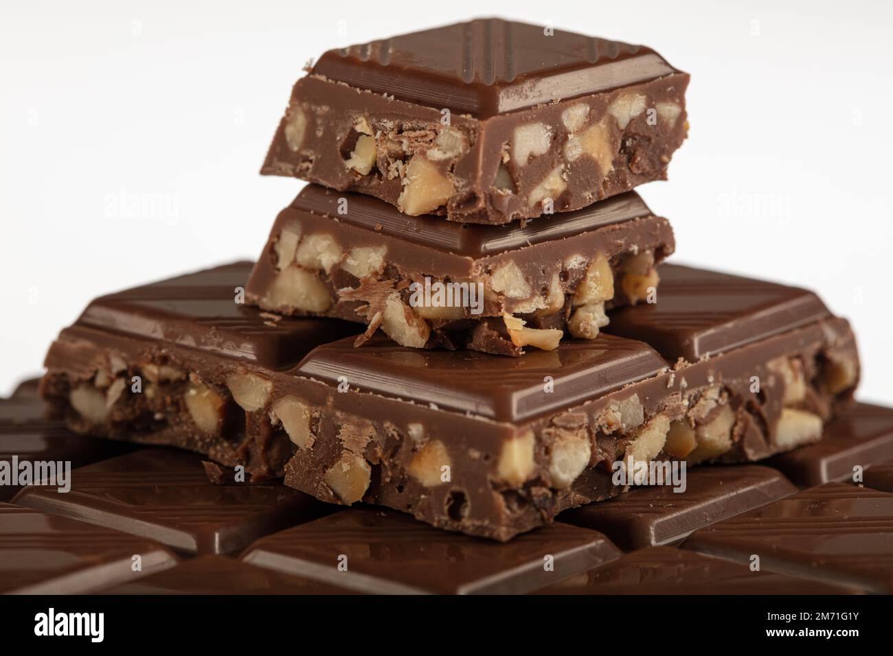 Hazelnut chocolate. Hazelnut chocolate bar pieces tower. Bars of milk