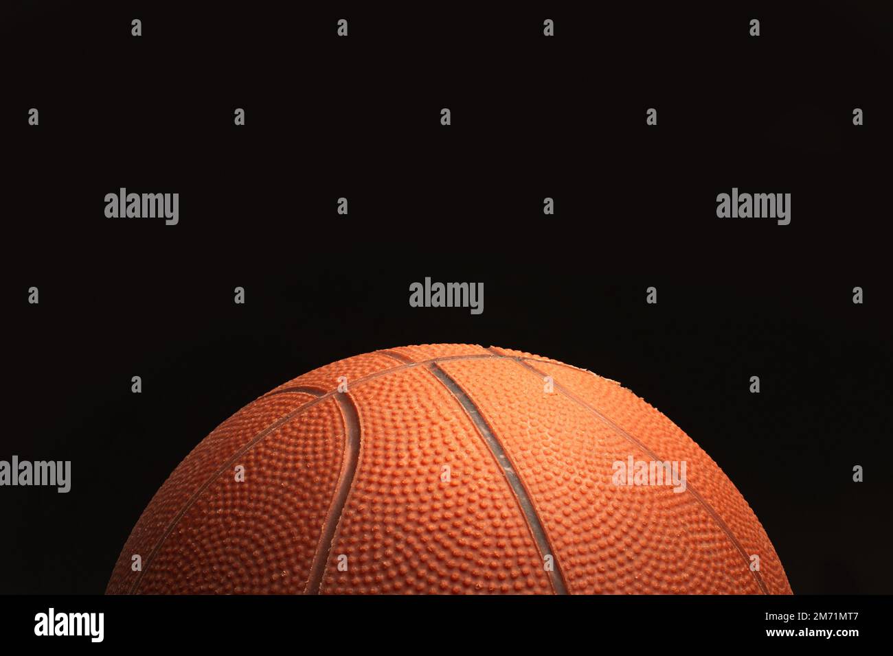 A basketball ball on a black background with copy space Stock Photo - Alamy