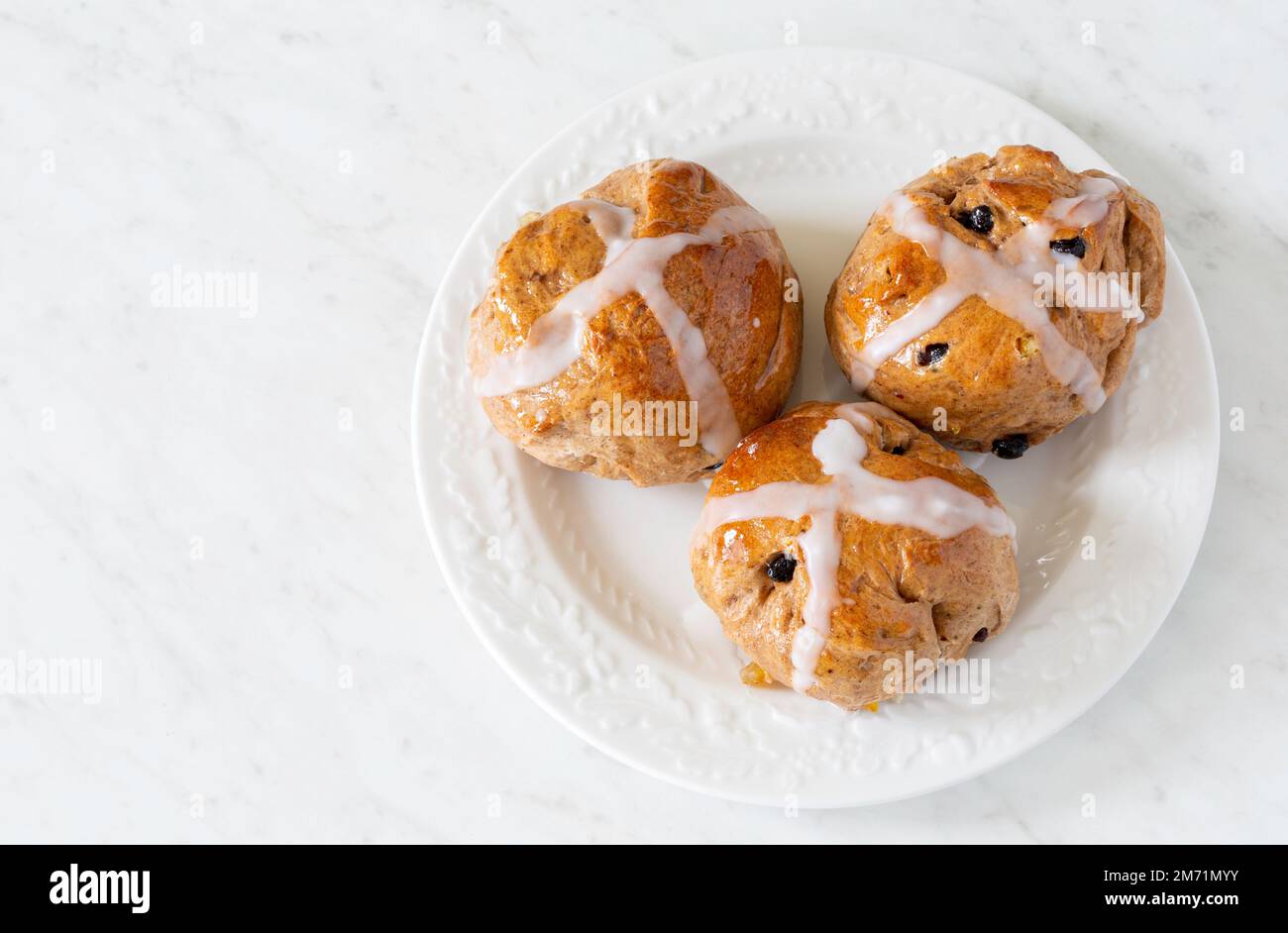 Homemade traditional hot cross buns with fruit and raisins Stock Photo