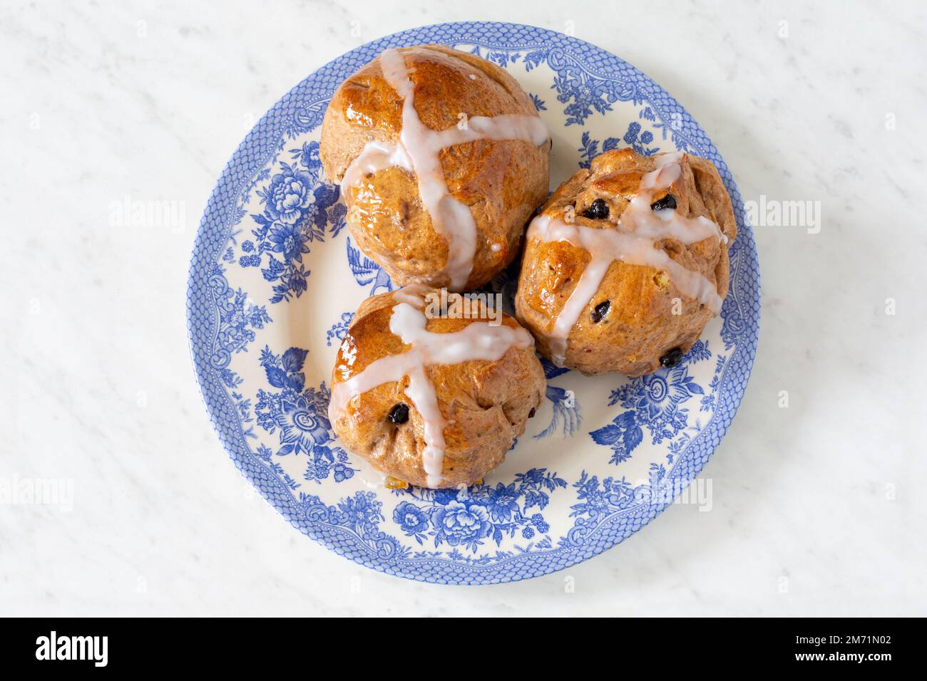 Homemade traditional hot cross buns with fruit and raisins Stock Photo