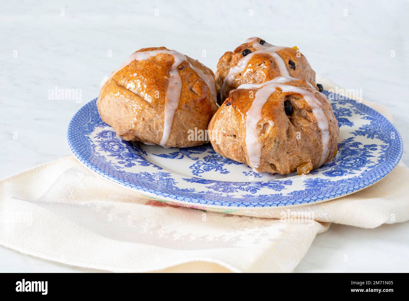 Homemade traditional hot cross buns with fruit and raisins Stock Photo