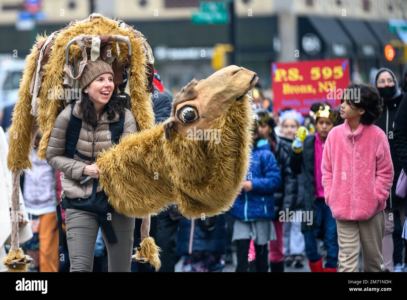 New York, USA. 6th Jan, 2023. A participant wearing a camel costume has fun as she marches in the streets of East Harlem during the 46th annual Three Kings Day Parade organized by El Museo del Barrio. The traditional Spanish celebration was held in person for the first time since the start of the coronavirus (COVID-19) pandemic. The theme for this year was: 'Entre Familia: Mental Health & Wellness of our Communities' focusing on the importance of mental health and wellness. Credit: Enrique Shore/Alamy Live News Stock Photo
