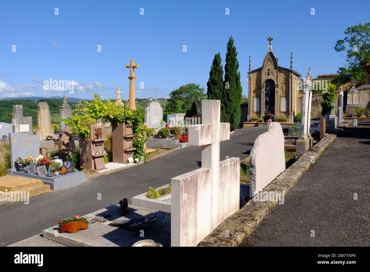 Moire: Cemetery overlooking the hills and vineyards in Moire, Beaujolais, Rhone, France Stock Photo