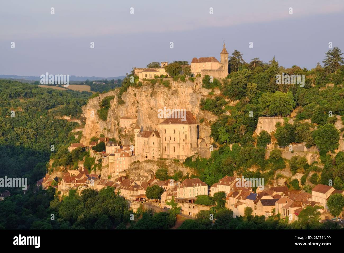 Rocamadour: Clifftop village, churches and sanctuary soon after sunrise at Rocamadour, Lot, Dordogne, Occitanie, France Stock Photo