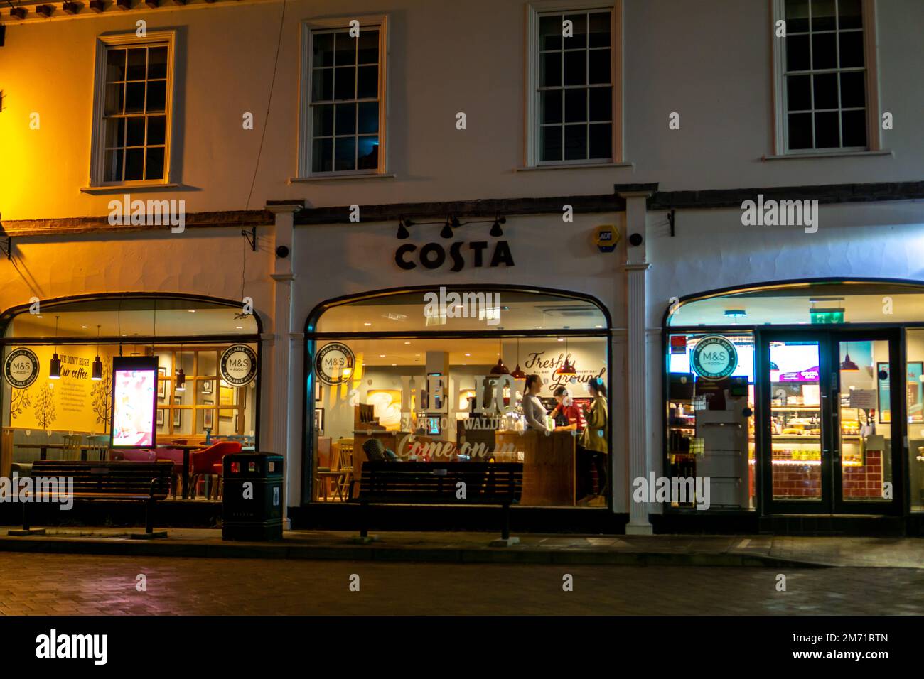 Costa coffee shop lit up at night in Saffron Walden Stock Photo Alamy