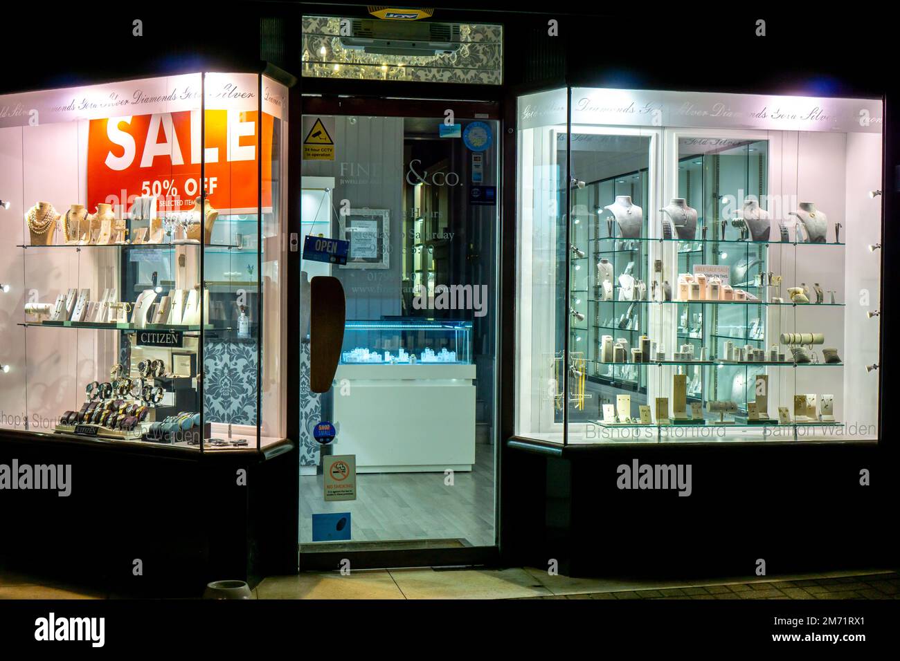 Jewellery shop window lit up at night in Saffron Walden Stock Photo Alamy