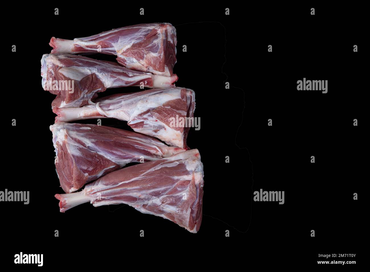 Raw lamb shanks meat, Raw lamb leg (Turkish name; kuzu incik). Fresh raw meat of leg young lamb. Raw lamb leg on marble stone background with herbs. I Stock Photo