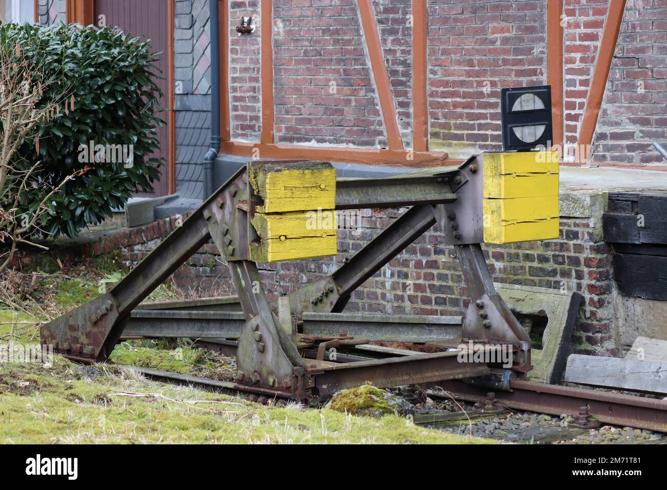 Buffer stop in a disused German train station Stock Photo
