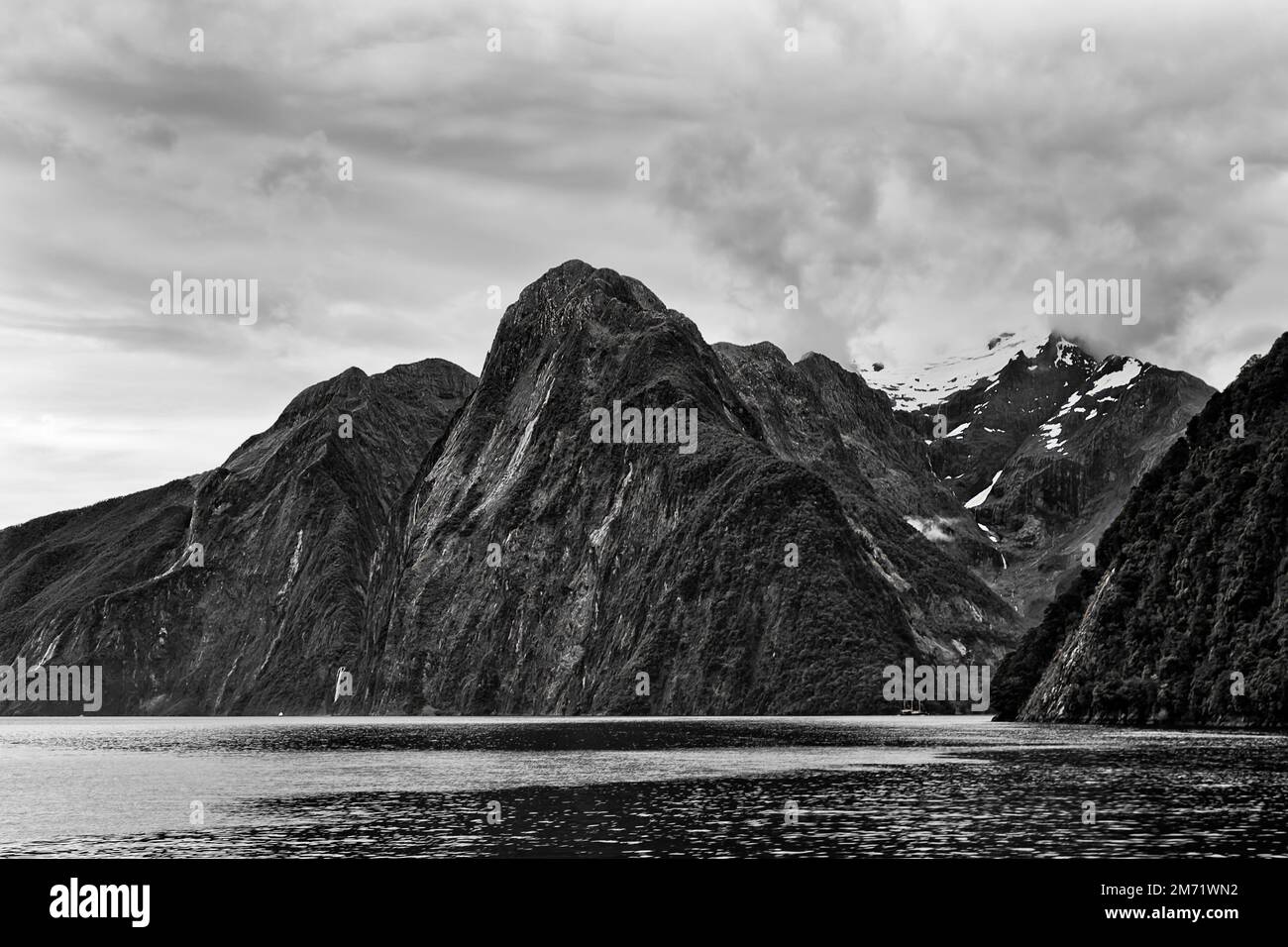 Dramatic black-white Pembroke mount in Milford sound fjord of southland in New Zealand Stock Photo