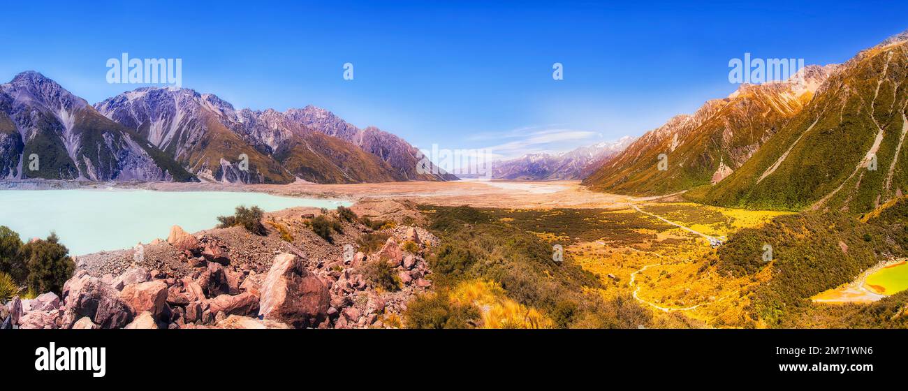 Panorama of Tasman river valley from Tasman glacier lake from Mt Cook in New Zealand. Stock Photo