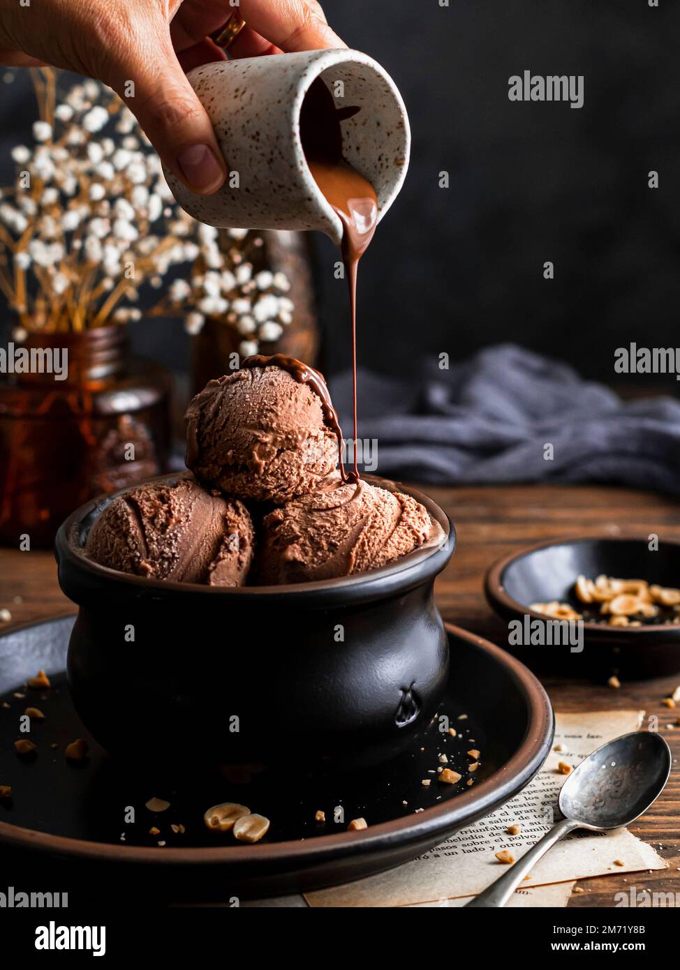 Chocolate ice cream in a black bowl Stock Photo - Alamy