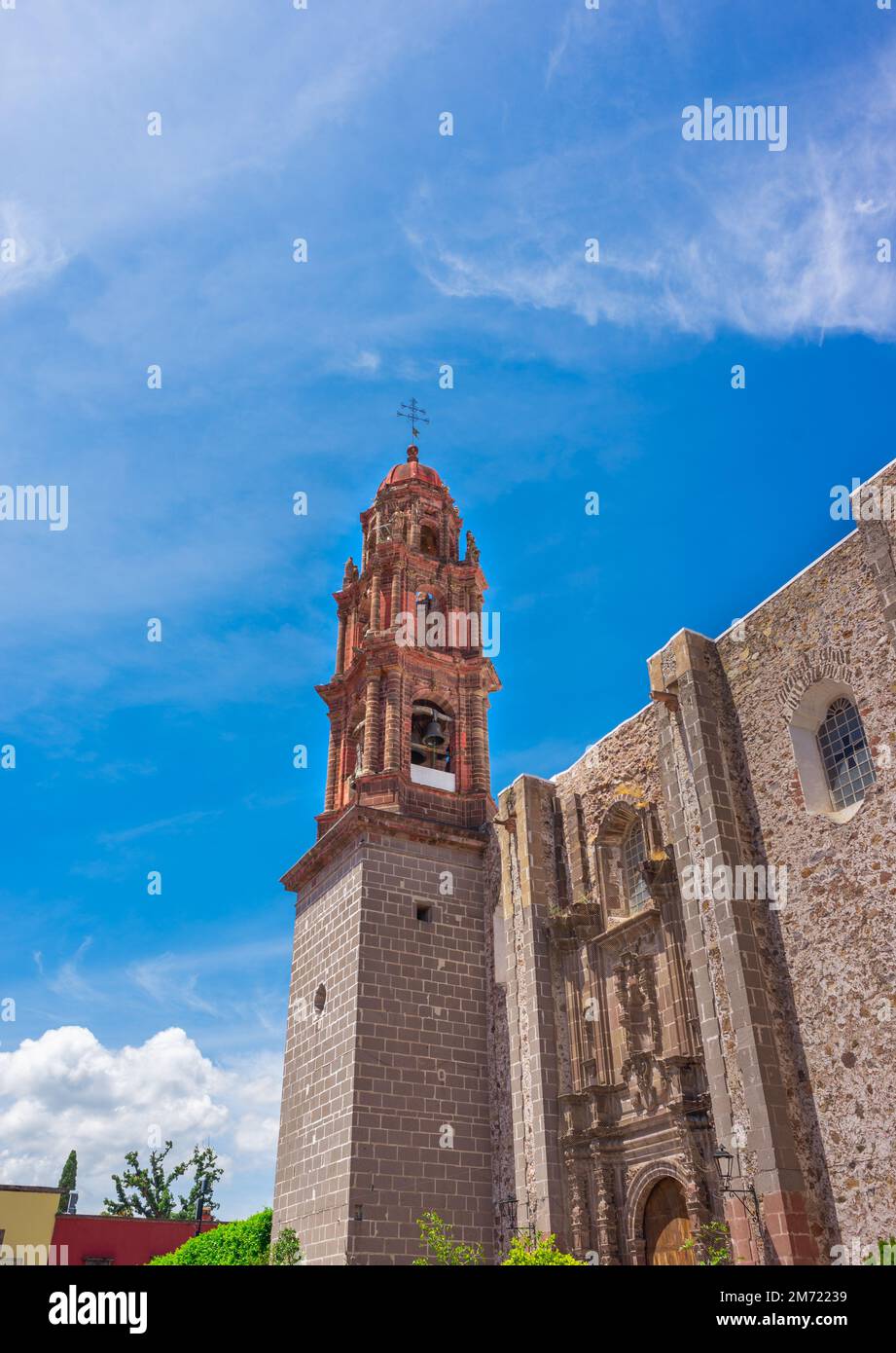 Beautiful Church of San Francisco in San Miguel de Allenda seen from the street, religious construction on summer day, no people Stock Photo