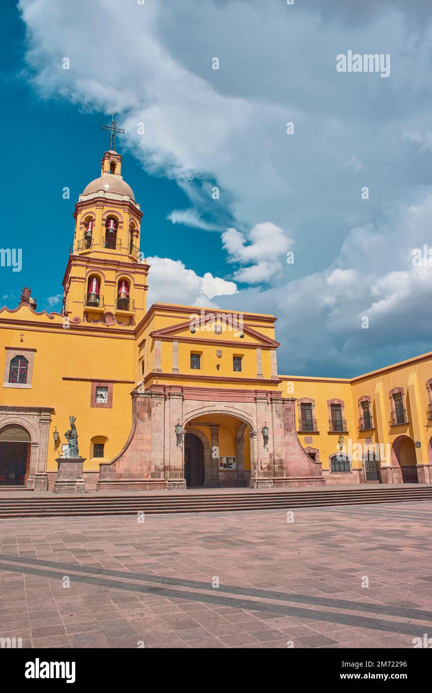 Santiago de Queretaro, Queretaro, Mexico, 09 07 22, Main entrance of the Temple and Convent of the Holy Cross of Miracles with a blue sky and clouds, Stock Photo