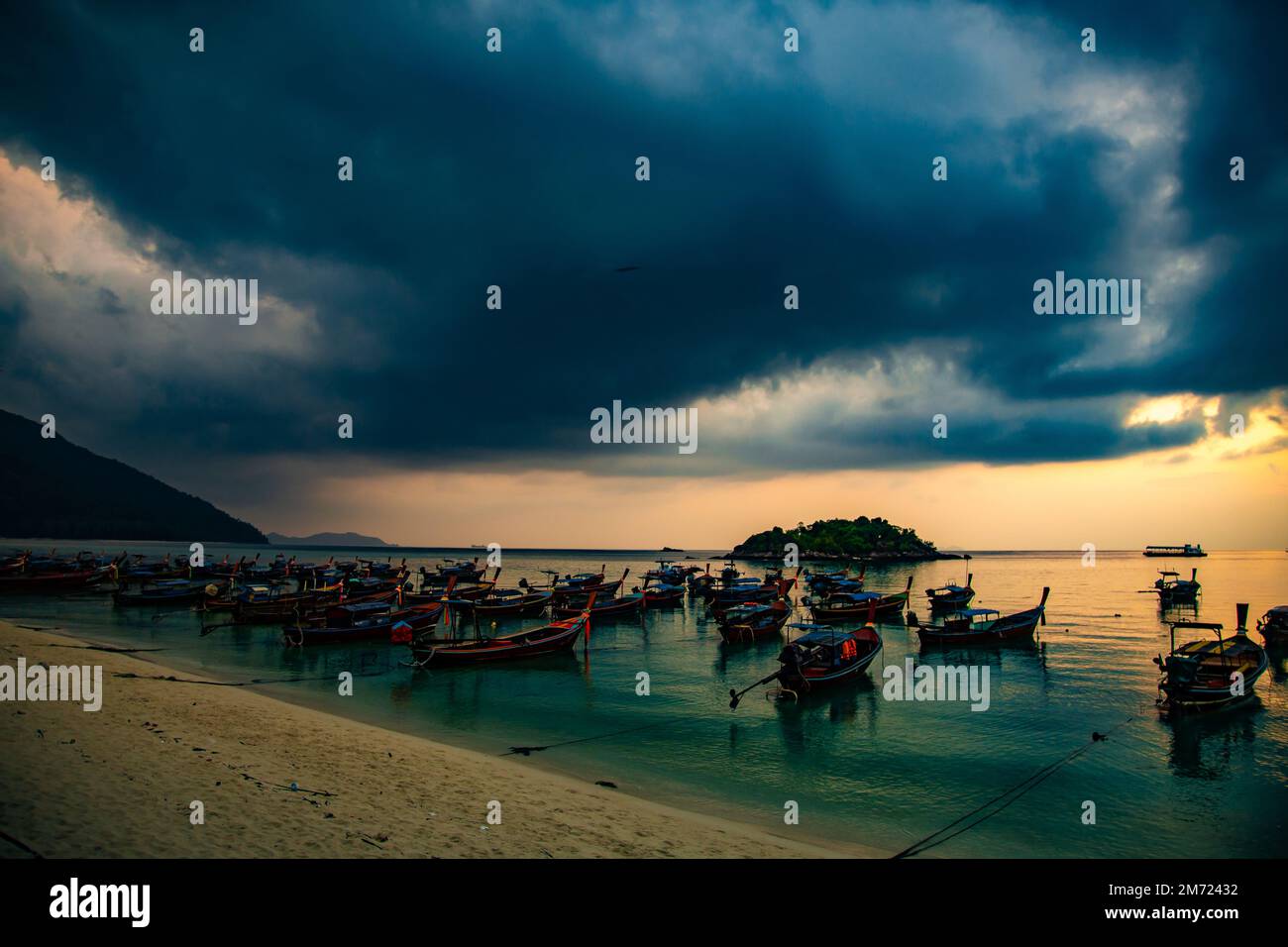 Sunrise beach with long tail boats in Koh Lipe, Satun, Thailand Stock Photo