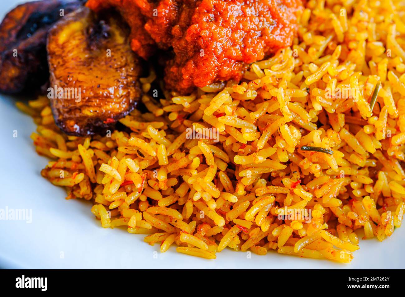 nigerian Jollof Rice served with plantain and stew Stock Photo - Alamy nigerian Jollof Rice served with plantain and stew Stock Photo - Alamy
