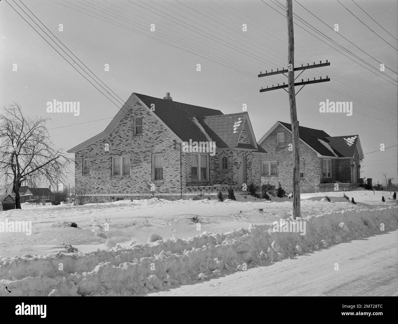 Shabby brick houses typical of Franklin Township near Bound Brook, New Jersey. Historic image. Mydans, Carl, photographer. Circa 1936. Stock Photo