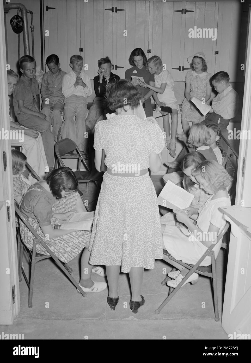 Sunday school lesson at the community house of the Casa Grande Valley Farms. Pinal County, Arizona, historic photo. Lee, Russell, photographer. Circa 1940. Stock Photo