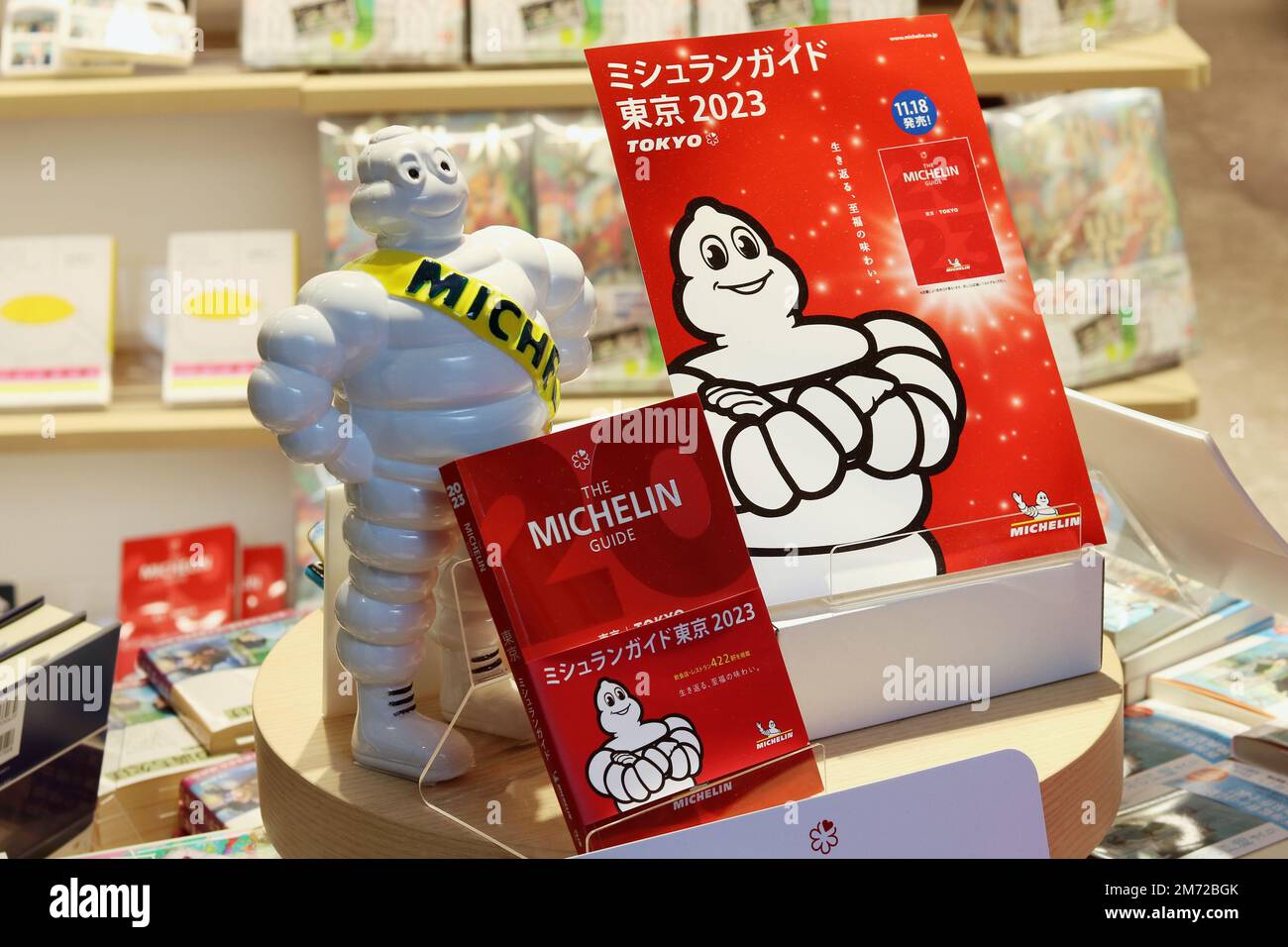TOKYO, JAPAN - November 24, 2022: Display promoting the Michelin Guide Tokyo 2023 featuring a Michelin Man in Kinokuniya book Stock Photo