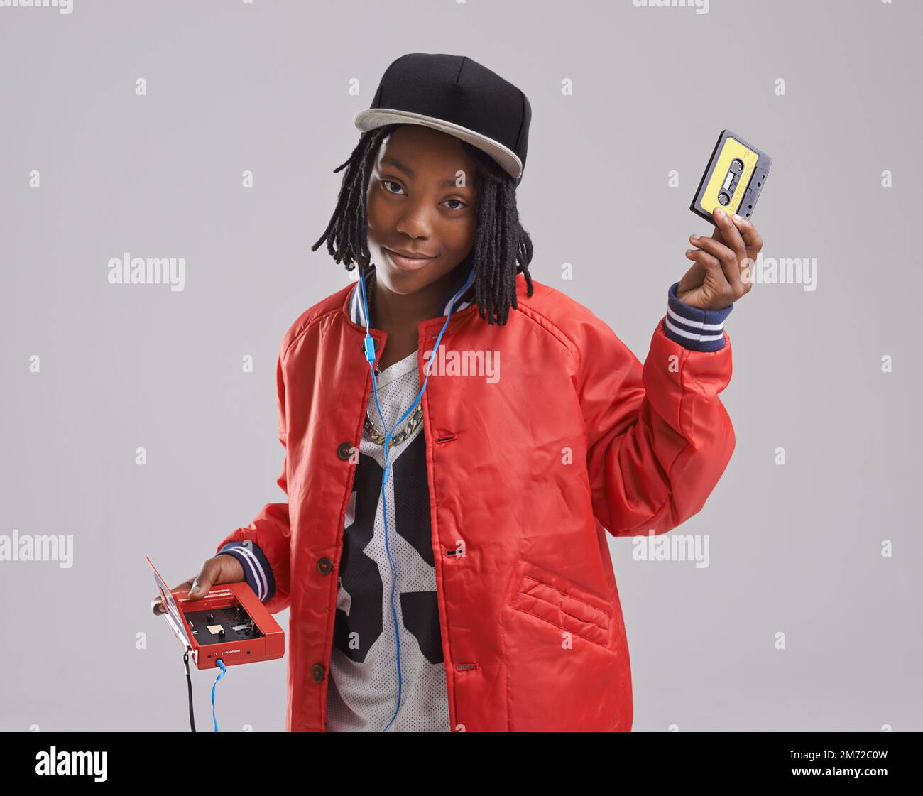 Rocking it old school. Studio shot of a young boy dressed in hip hop attire. Stock Photo