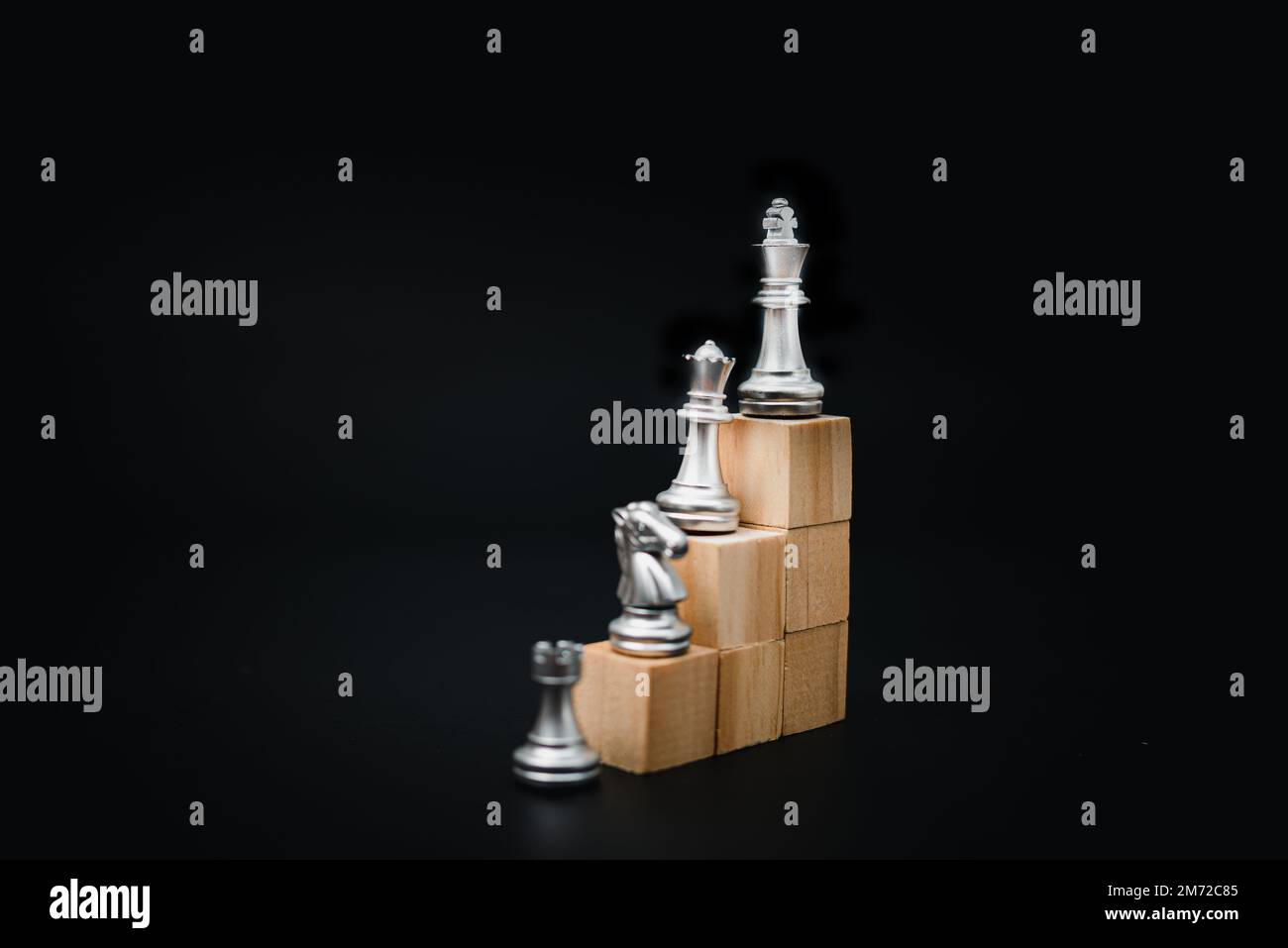 development and improvement in corporate growth and professional Success idea concept of business leader or entrepreneur.Chess on wood cube. Stock Photo
