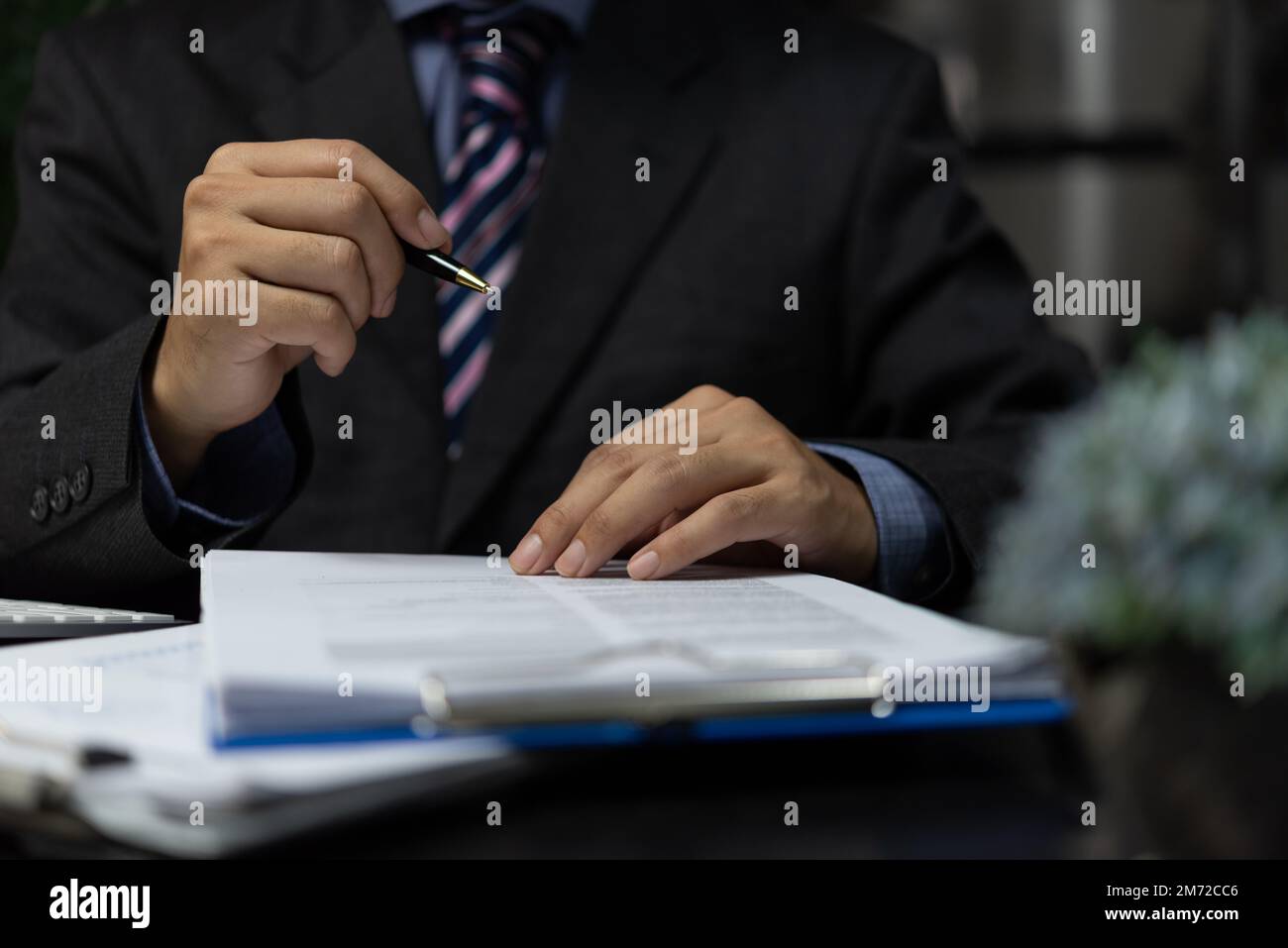 Businessperson signing contract, partnership agreement and Lawyer, broker or HR manager executive manager hand filling paper. business document signat Stock Photo