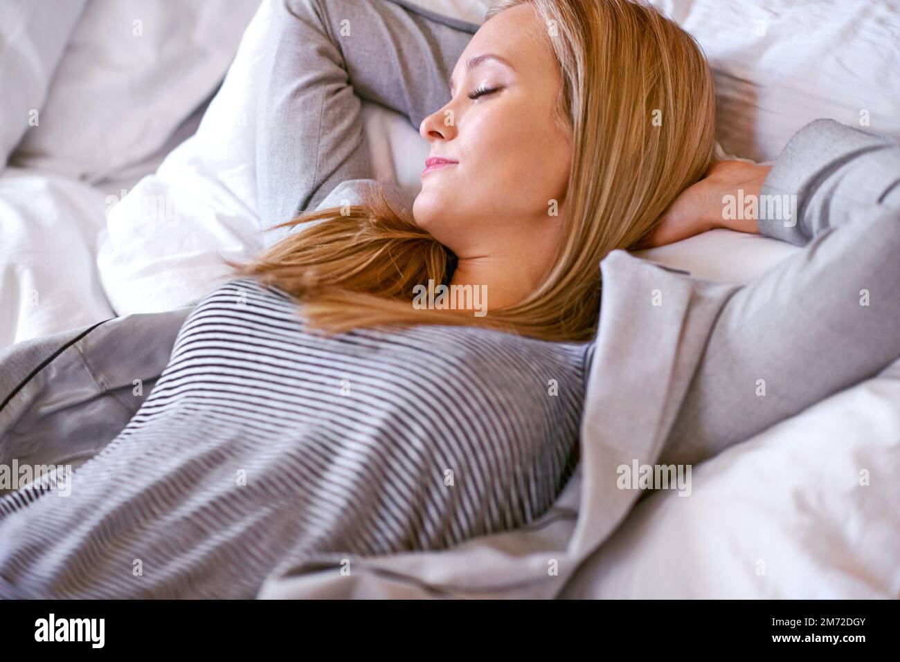 Finally some peace and quiet. an attractive young woman relaxing on her