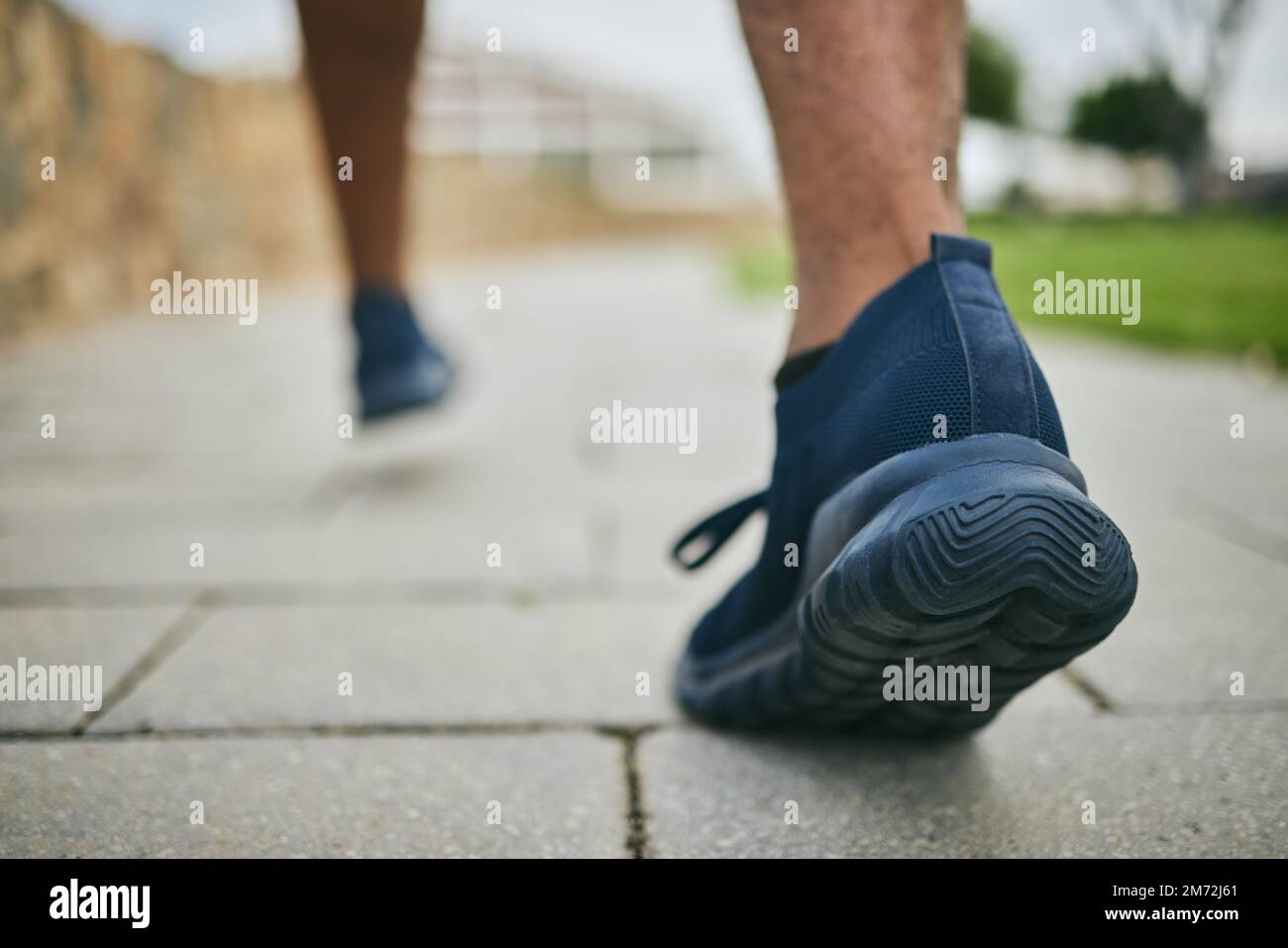 Running shoes, exercise and fitness with feet of a man outdoor on a