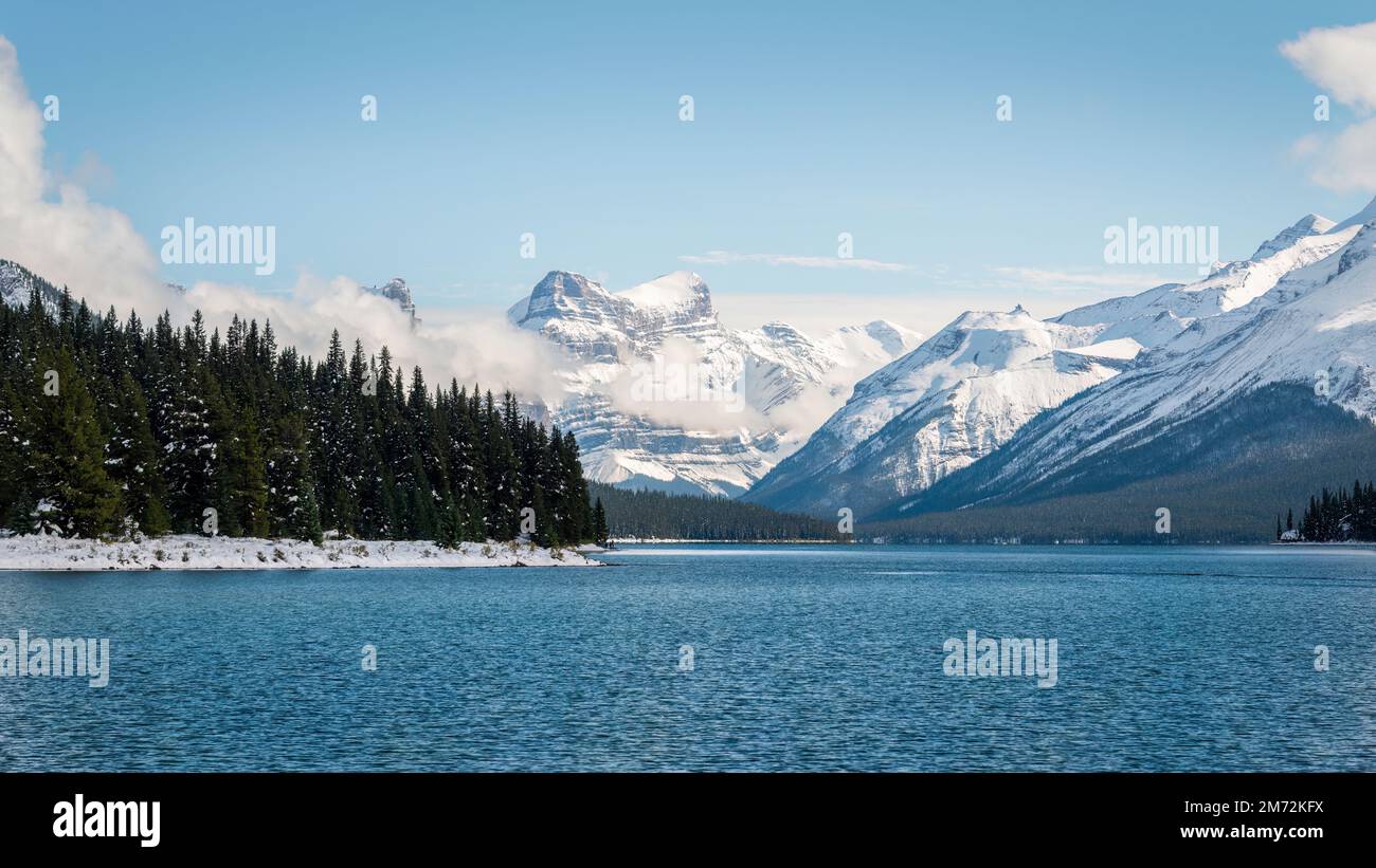 Maligne Lake in Jasper National Park, Snow-capped mountains towering ...