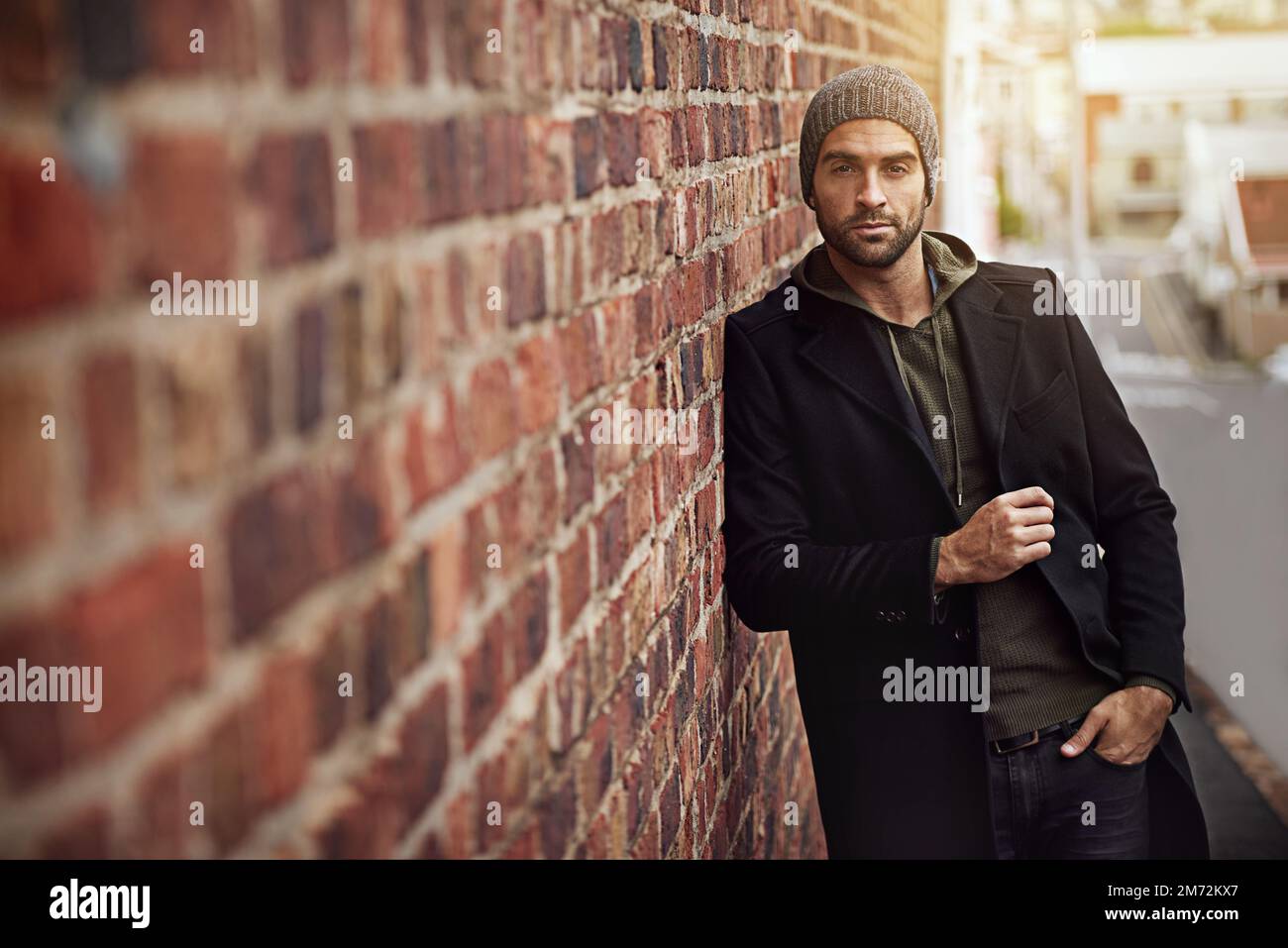 Its not just a city, its my life. a handsome young man in trendy winter ...