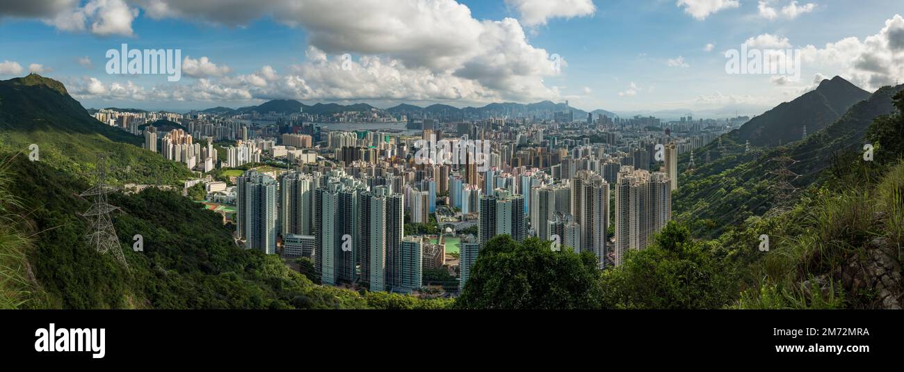 Hi-res panorama of the high-density development of Kowloon, looking south from Sha Tin Pass Road to Hong Kong Island, 2017 (72Mpx) Stock Photo