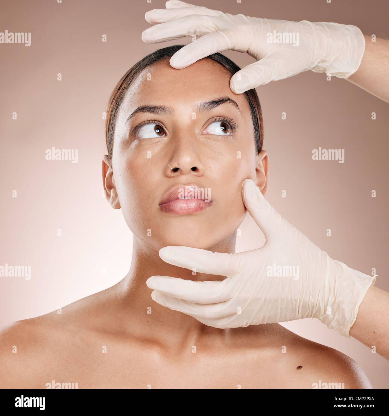 Plastic surgery, botox and hands check woman face for laser, beauty implant or cosmetic salon. Skincare consultation, facial and gloves for aesthetic Stock Photo