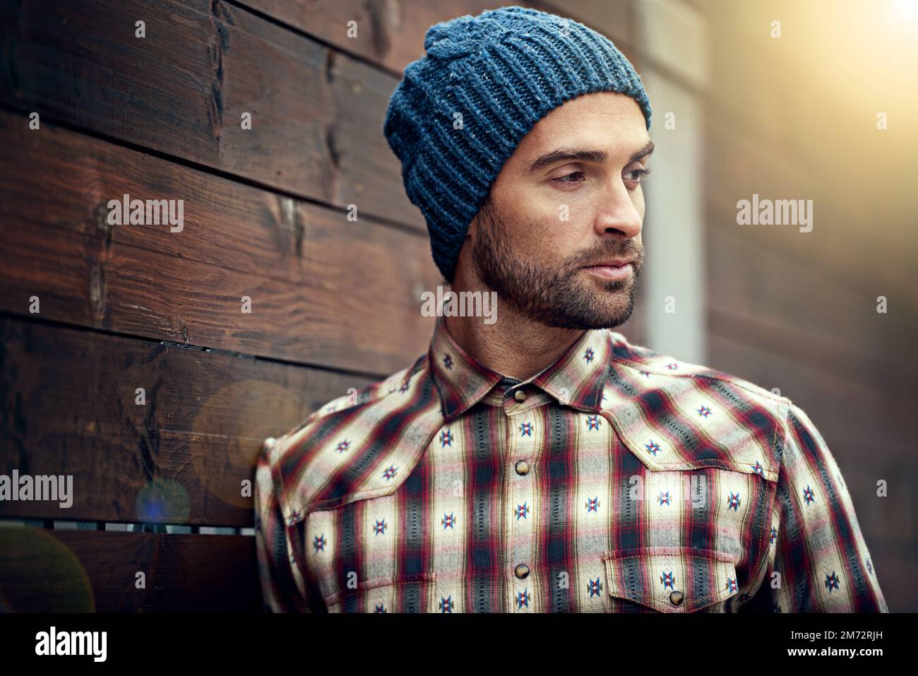 Cooler than the temperature outside. A handsome young man in winter attire. Stock Photo