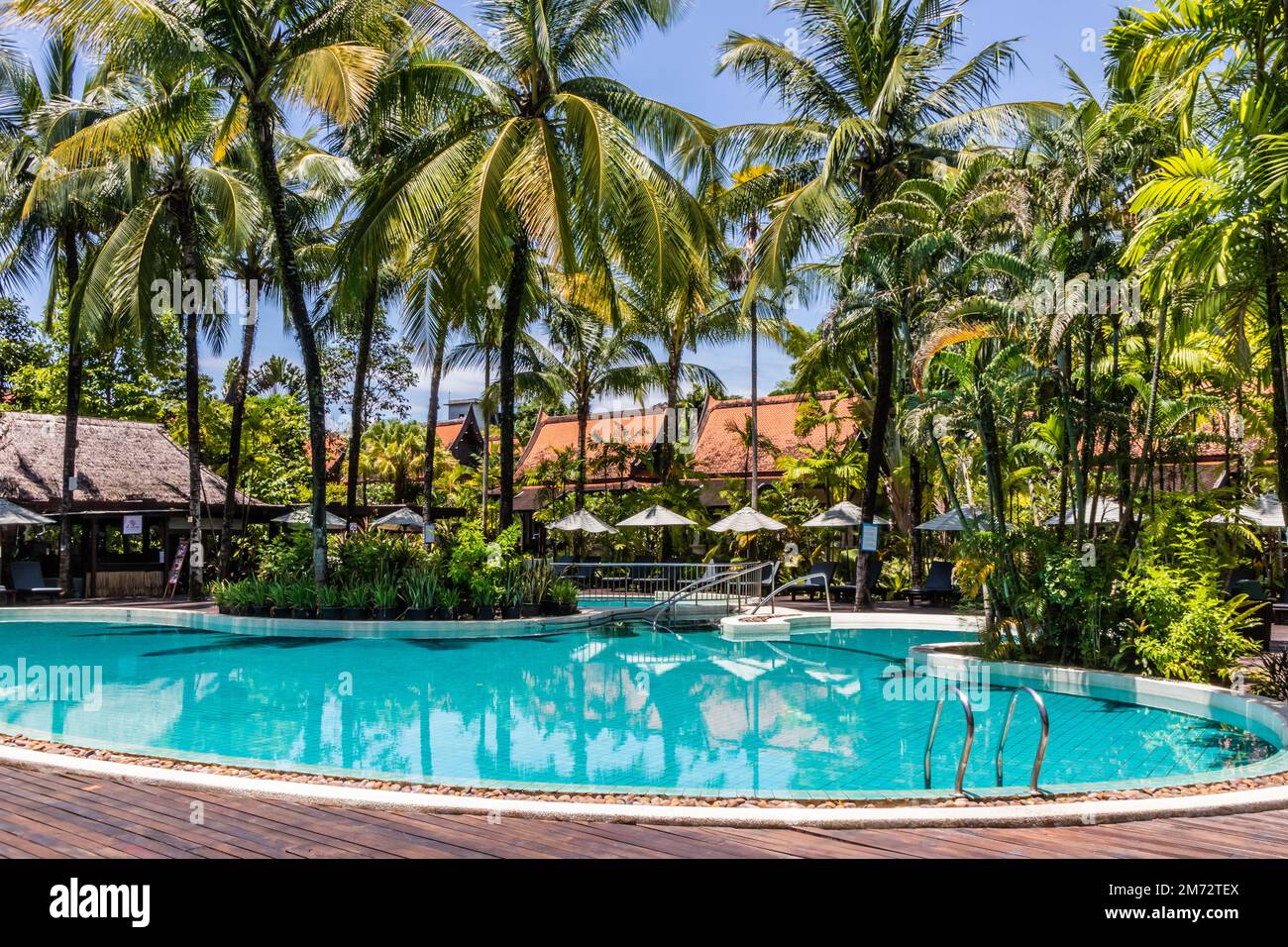 Tropical hotel swimming pool Stock Photo
