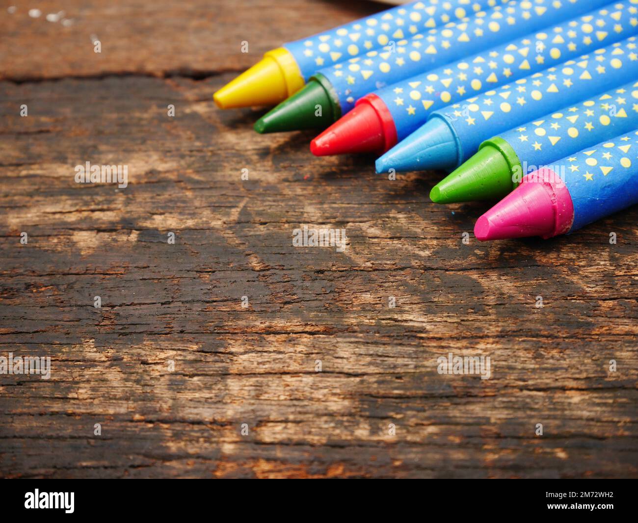 Many color crayon on wood board with copy space Stock Photo Alamy