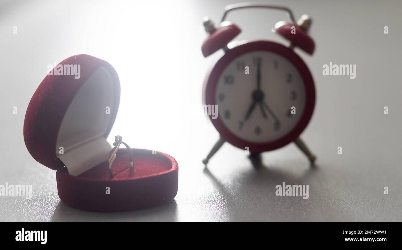 Wedding ring, alarm clock Tell time in life Stock Photo Alamy