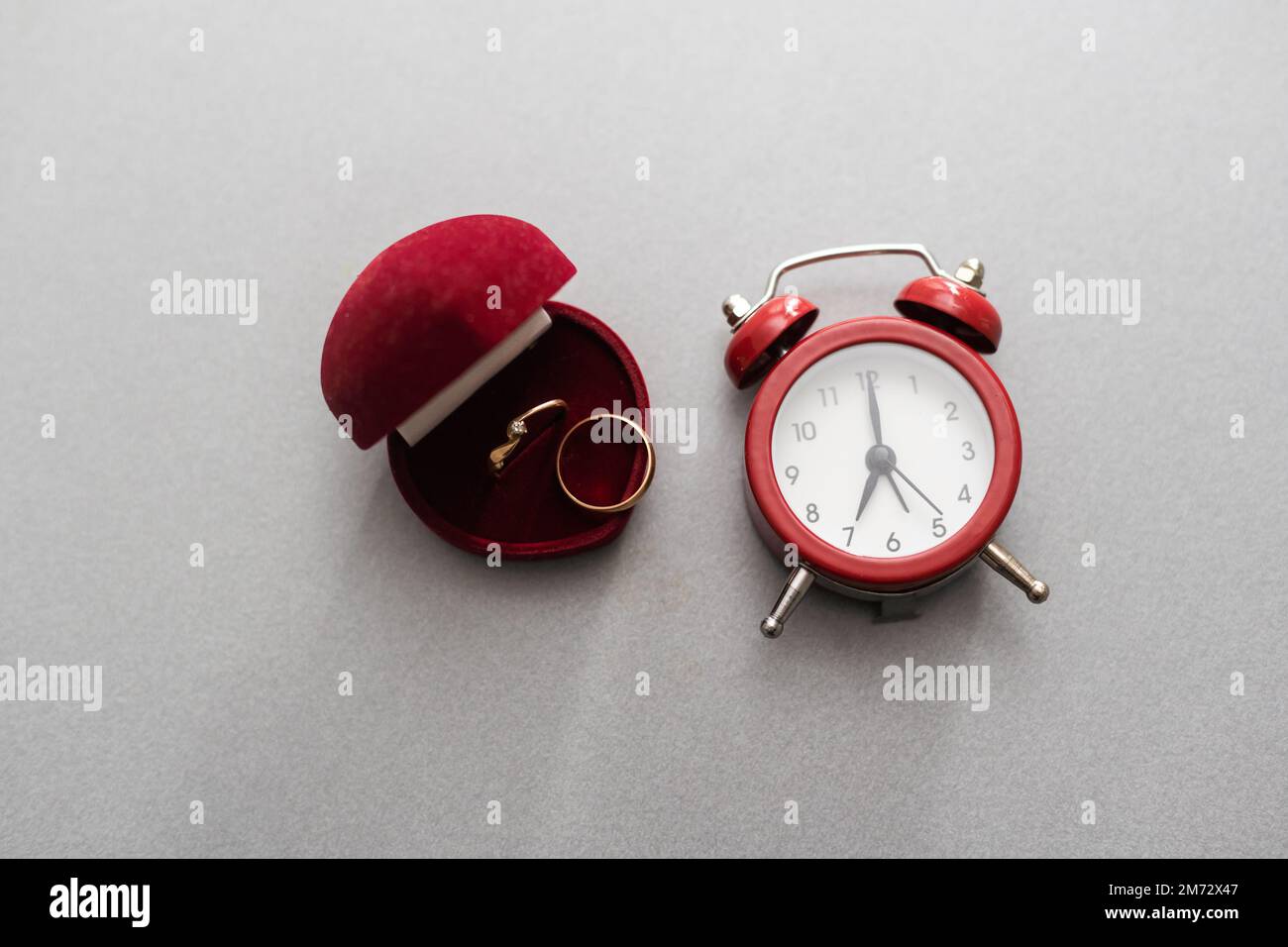 Wedding ring, alarm clock Tell time in life Stock Photo Alamy