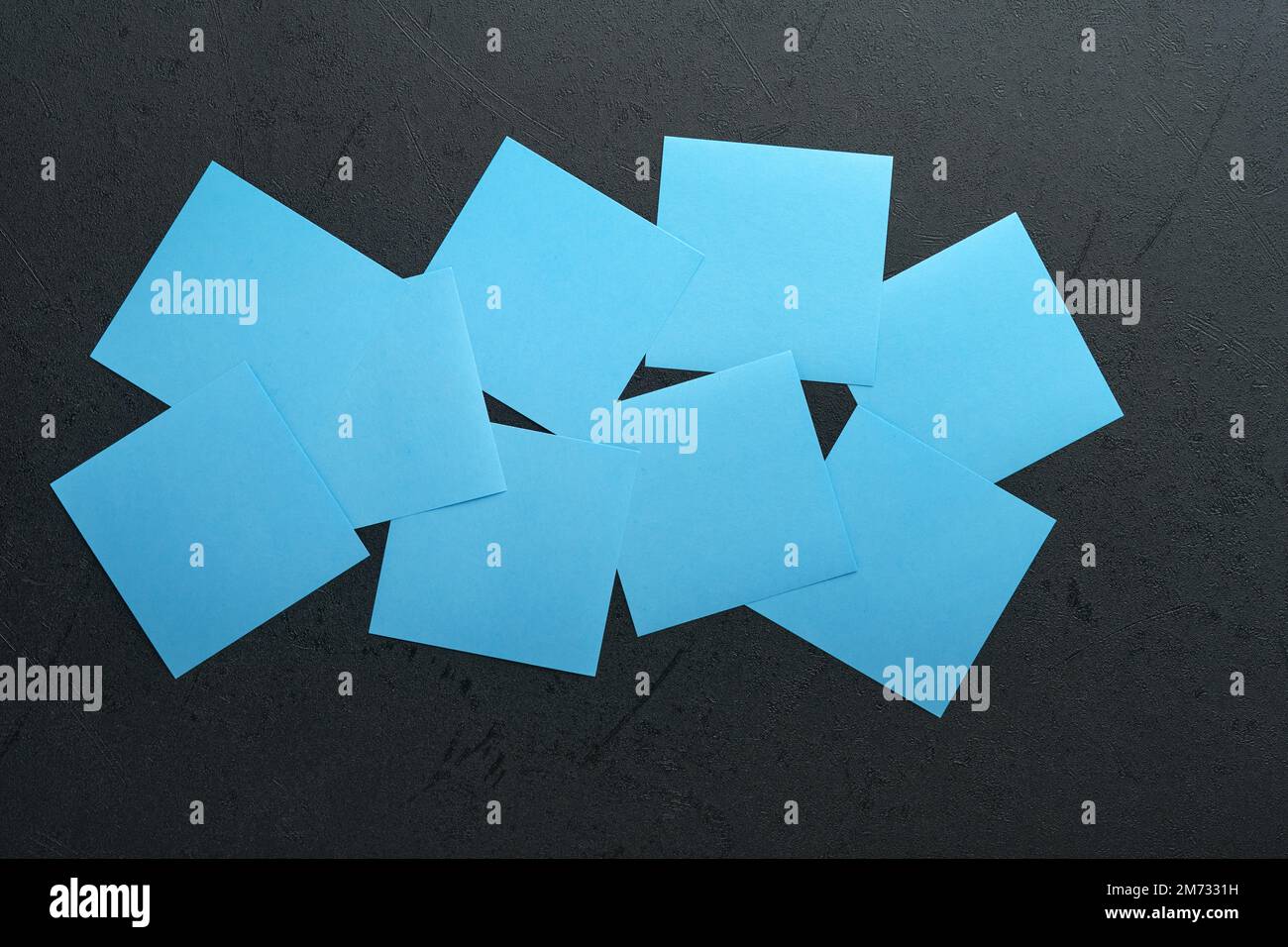 Blue paper stickers on black background. Sticky notes blank with copy ...