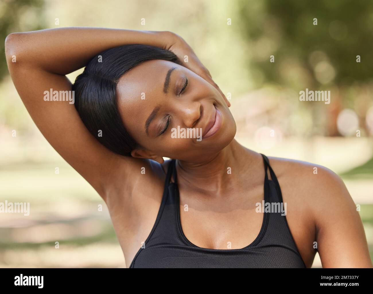 Black woman, fitness or neck stretching in nature park for healthcare wellness, relax exercise or workout training. Sports athlete, person or runner Stock Photo