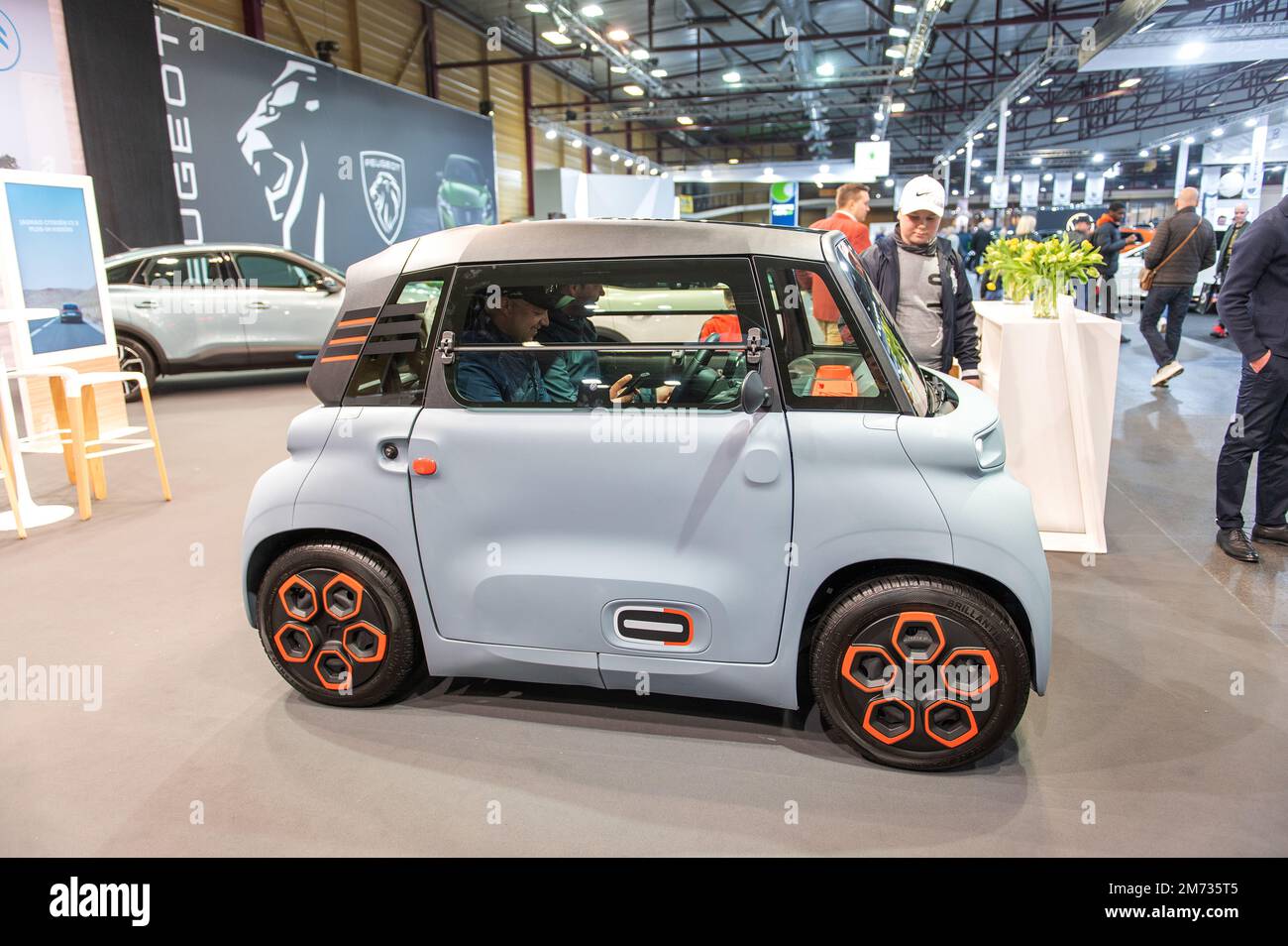 https://c8.alamy.com/comp/2M735T5/rigalatvia-april-29-2022-people-are-enjoying-about-french-small-citroen-ami-electric-two-seater-micro-city-car-2M735T5.jpg