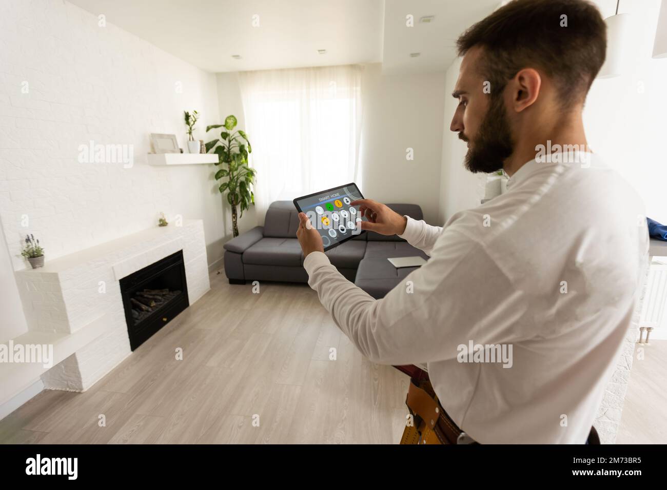 All in one smart home control system app concept on tablet display in ...