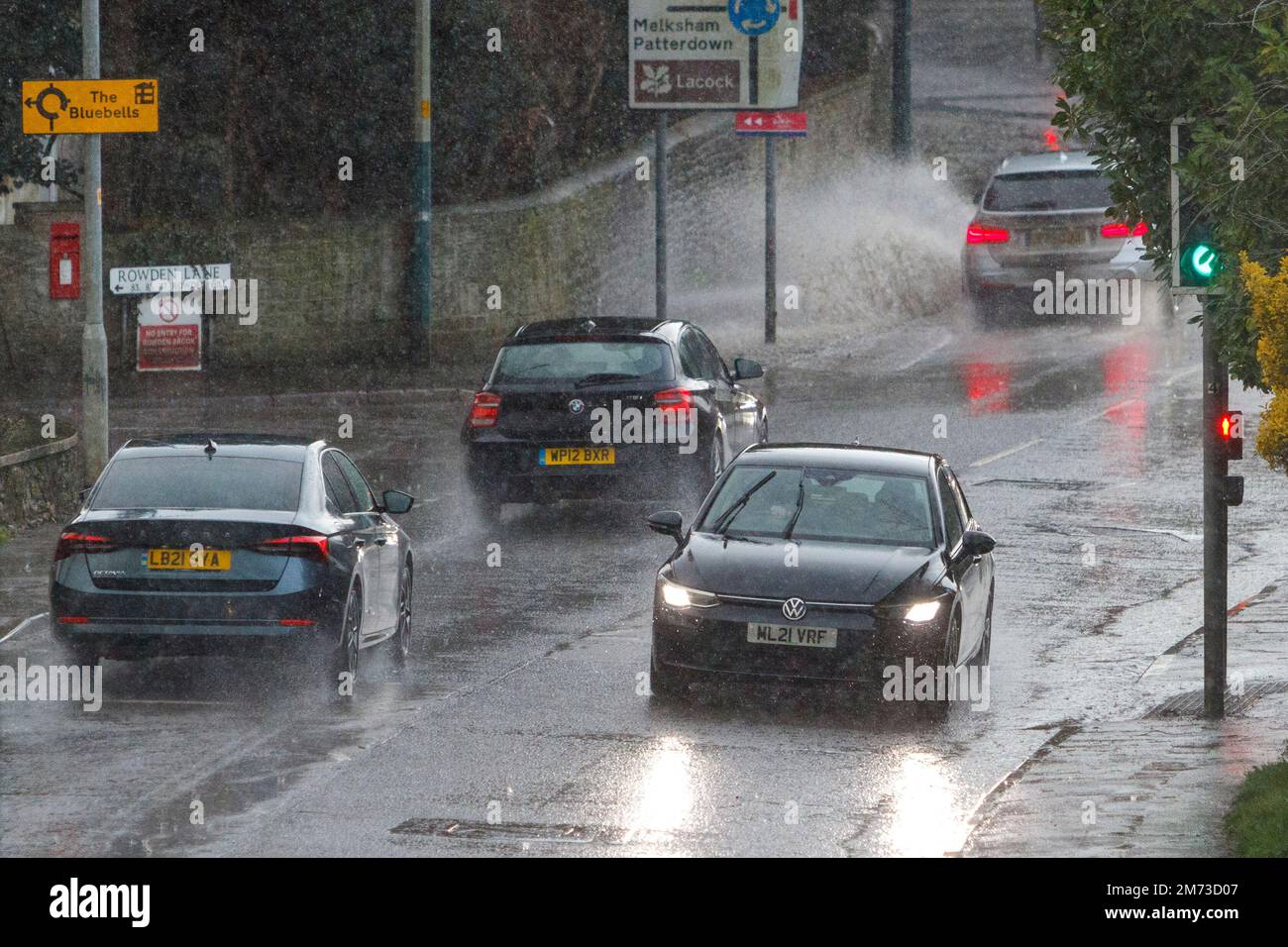 Chippenham, Wiltshire, UK. 7th January, 2023. Drivers are pictured braving  heavy rain in Chippenham as showers make their way across Southern England. Credit: Lynchpics/Alamy Live News Stock Photo