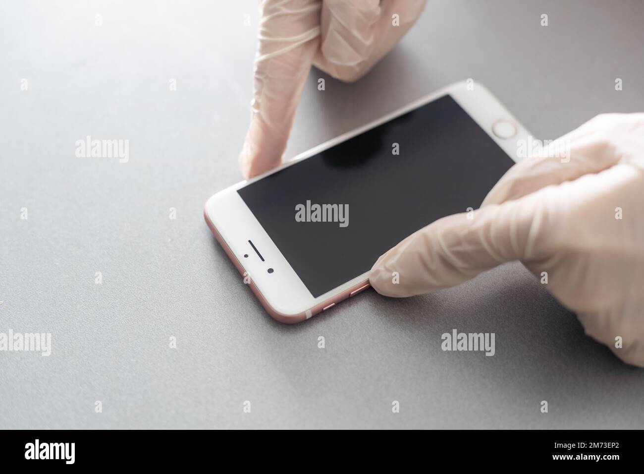 hands holding pressing smartphone buttons Stock Photo