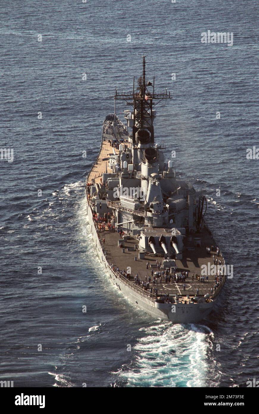 An aerial stern view of the battleship USS Missouri (BB 63) underway, July 1986 Stock Photo