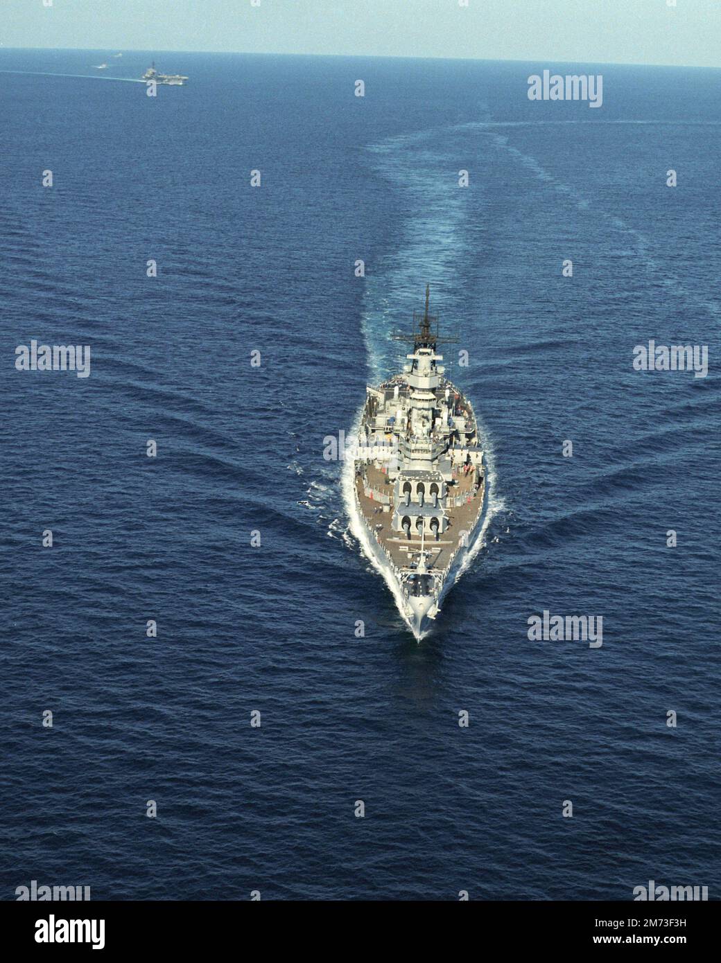An aerial bow view of the battleship USS Missouri (BB 63) underway, July 1986 Stock Photo