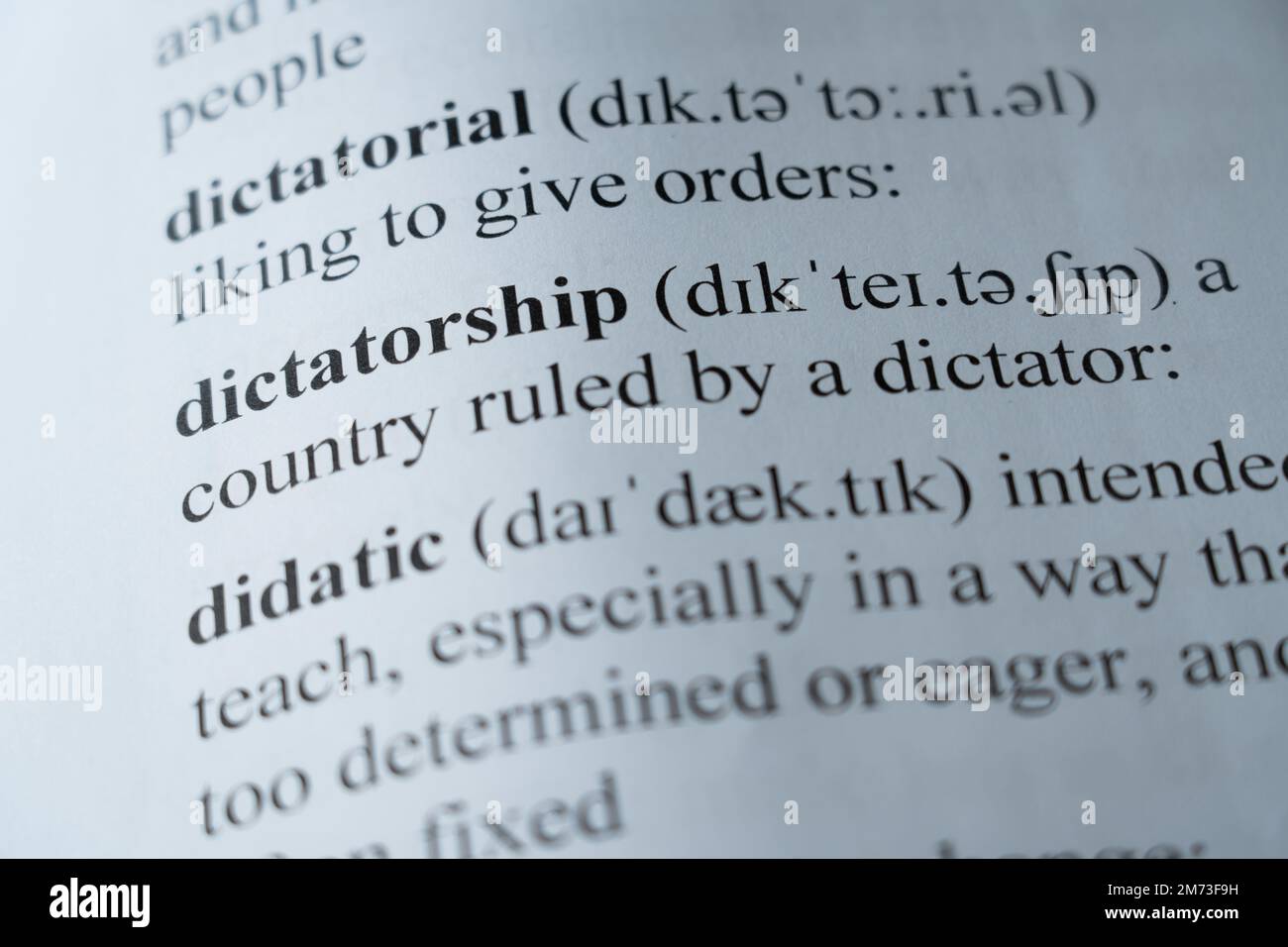 A mock up of a dictionary page with the word dictatorship with selective focussing Stock Photo