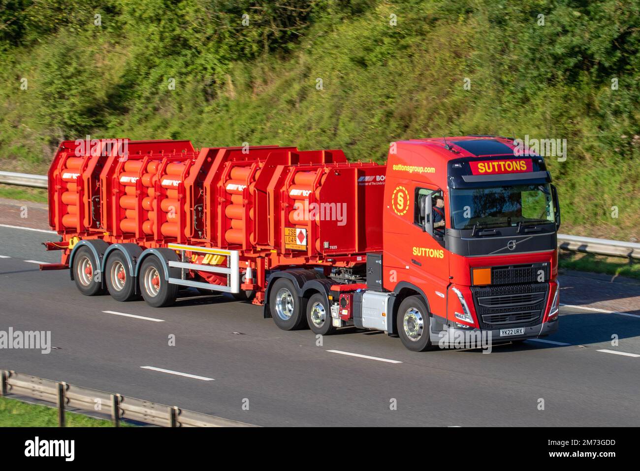 SUTTONS GROUP 2022 red Volvo 12777 cc  HGV transporting BOC Gases on the M6 motorway, UK Stock Photo