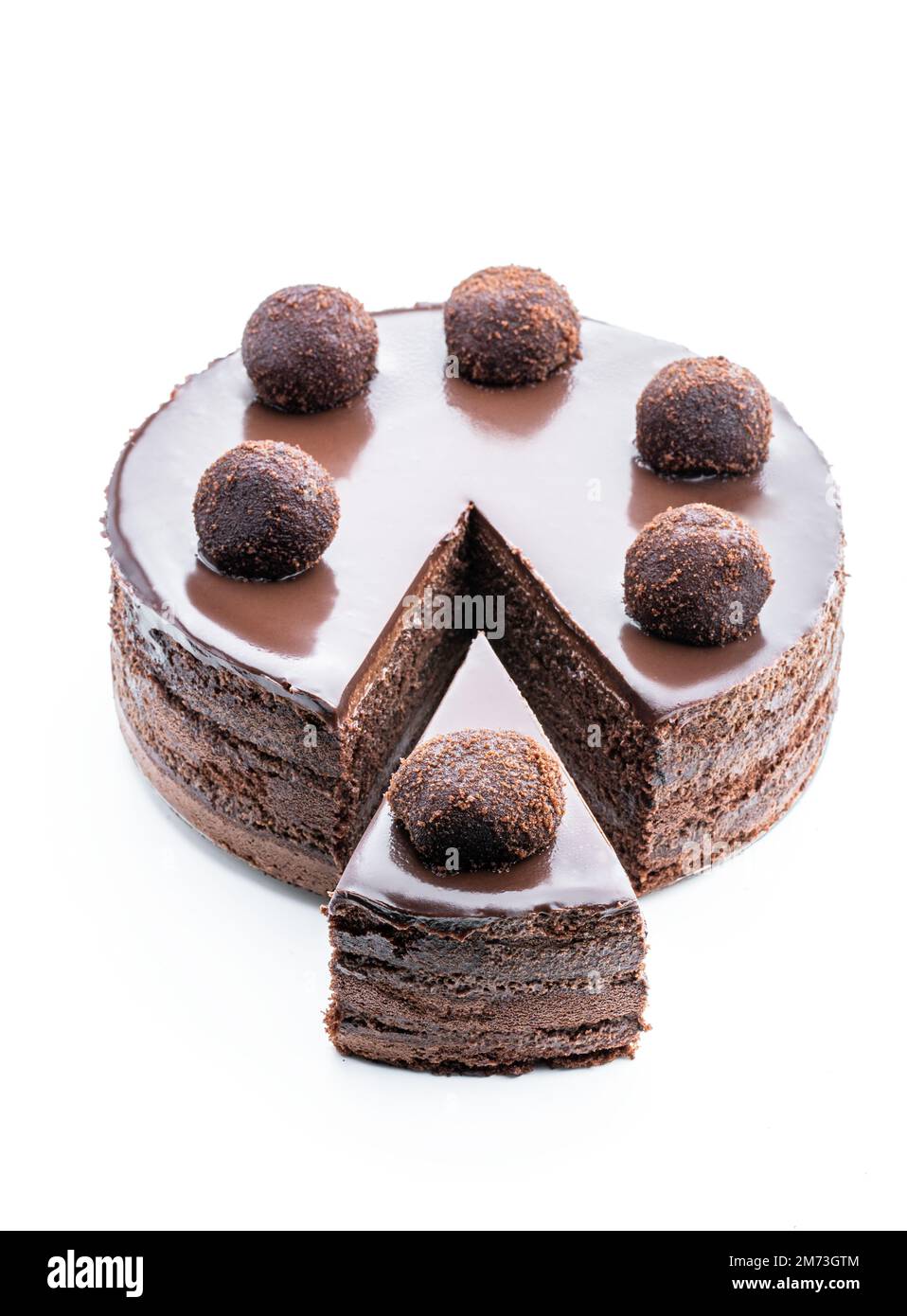 Tasty  chocolate cake decorated with truffle isolated on white Stock Photo